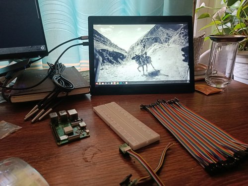 20 May 2026 — Day one. A Raspberry Pi 4, a breadboard and a ribbon of jumper wires. On the monitor, a caravan in Dho Tarap: a reminder of where this has to work.