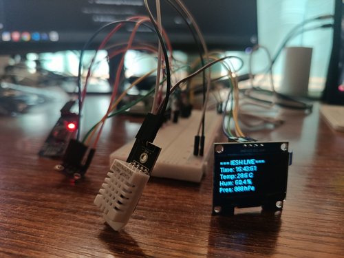 24 May — First live readings. A DHT22 and a BMP280 driving an OLED: “IESH LIVE — 29.5 °C, 50.4 %, 888 hPa.” The station can sense the room.
