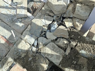 Sensor cables laid into the stone masonry as the wall goes up. Every cable is led out on the inside face, so a stack can be reconnected later.